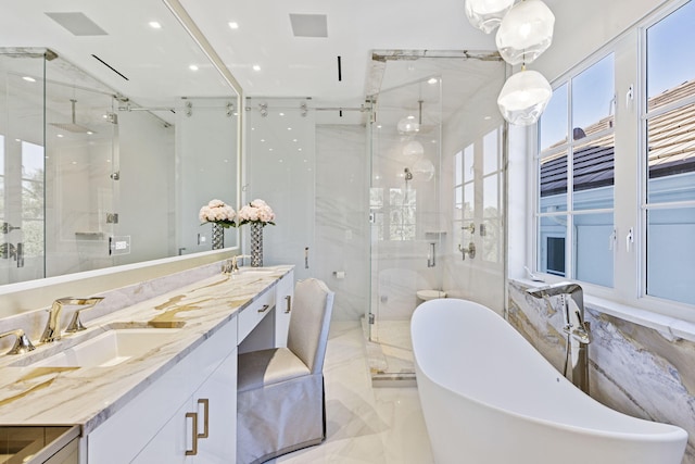 full bathroom with marble finish floor, double vanity, a freestanding bath, a sink, and a shower stall