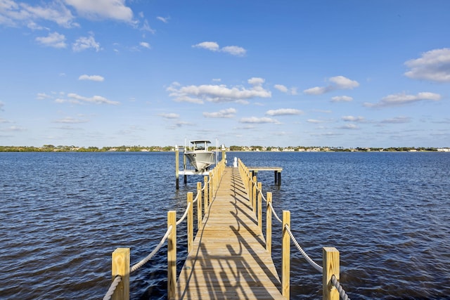 view of dock featuring a water view and boat lift