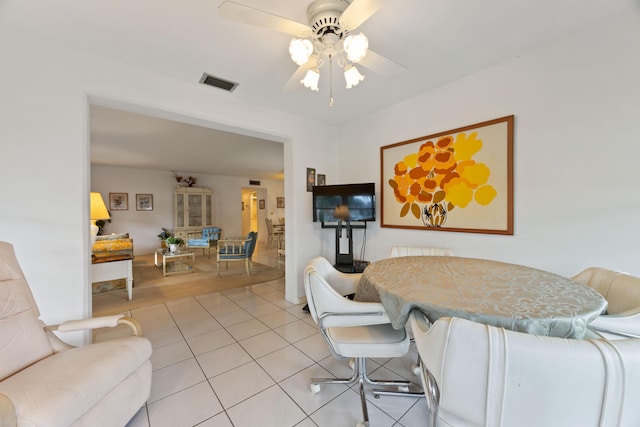 dining room with light hardwood / wood-style flooring and ceiling fan