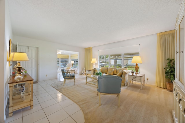 living room featuring a textured ceiling and light tile patterned floors