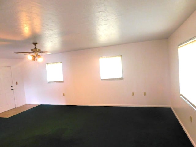 unfurnished room featuring a textured ceiling and ceiling fan