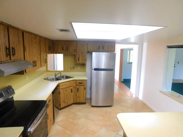 kitchen featuring stainless steel appliances and sink