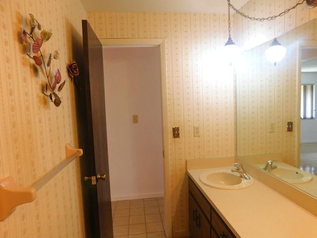 bathroom with tile patterned flooring and vanity