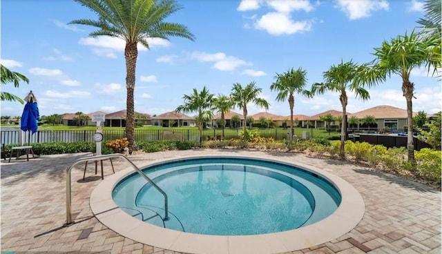 view of swimming pool featuring an in ground hot tub and a patio