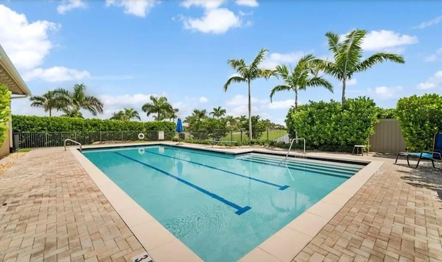 view of pool featuring a patio area