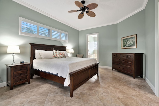 bedroom featuring ceiling fan, ensuite bath, and crown molding