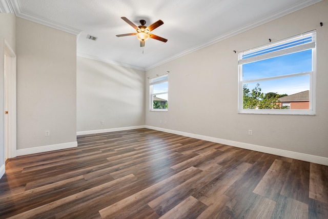 empty room with ornamental molding, dark hardwood / wood-style floors, and ceiling fan