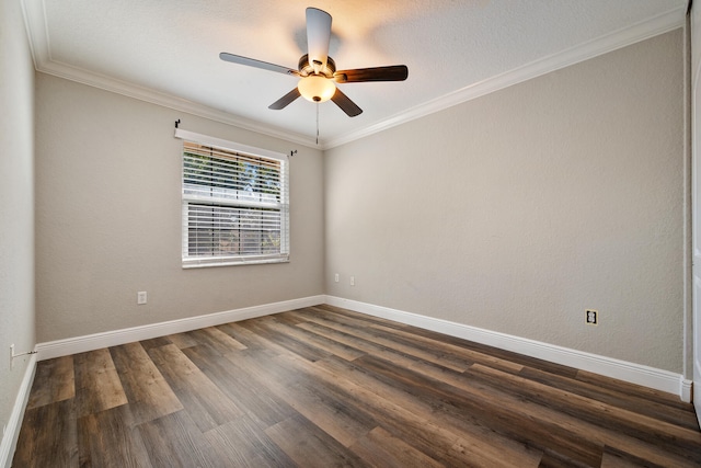 spare room with dark wood-type flooring, ceiling fan, and crown molding