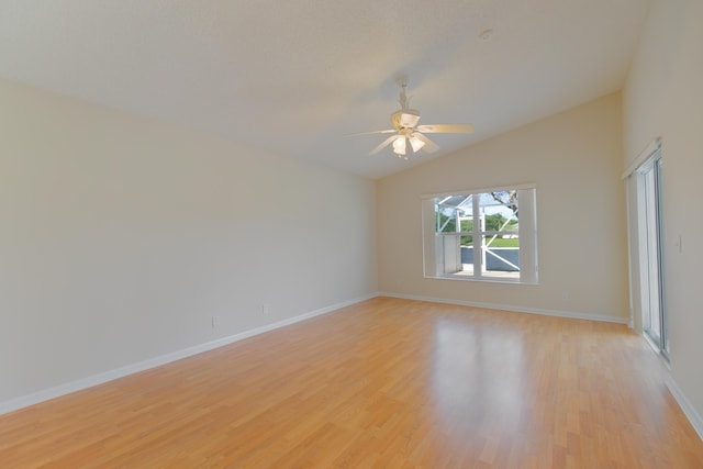 unfurnished room featuring lofted ceiling, light hardwood / wood-style floors, and ceiling fan