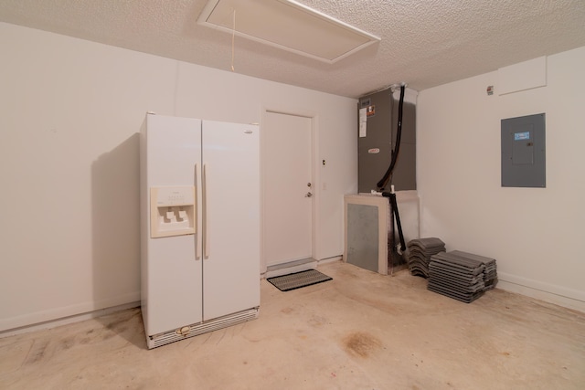 garage with electric panel and white refrigerator with ice dispenser