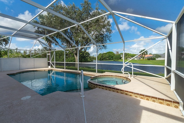 view of pool with a patio, an in ground hot tub, a water view, and glass enclosure