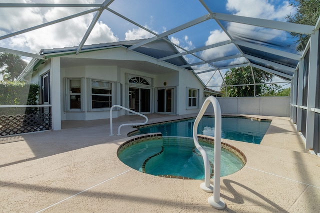 view of swimming pool with a patio and a lanai