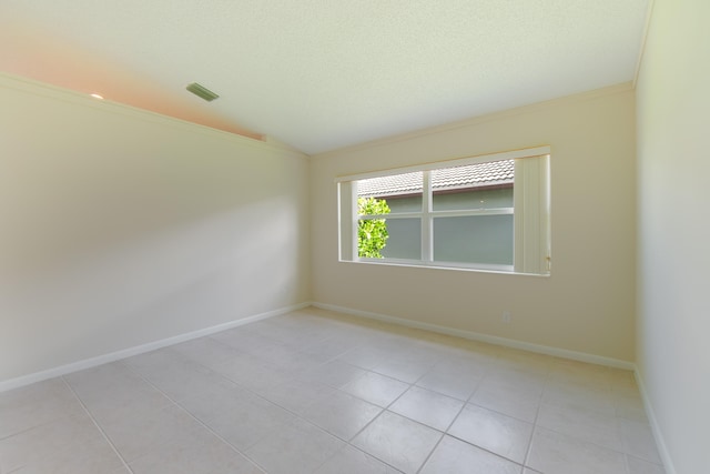 tiled empty room with ornamental molding