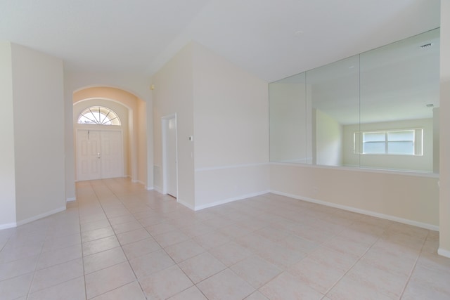 foyer with a healthy amount of sunlight and light tile patterned flooring