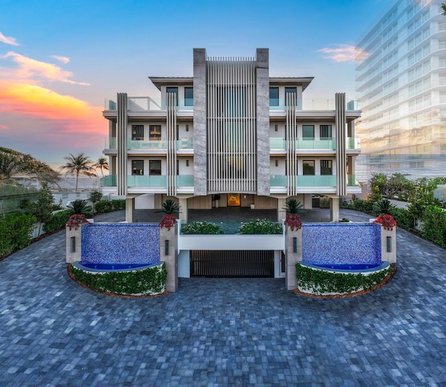 view of back of property at dusk