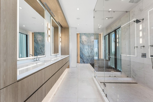 full bath featuring marble finish floor, double vanity, a sink, and a stall shower