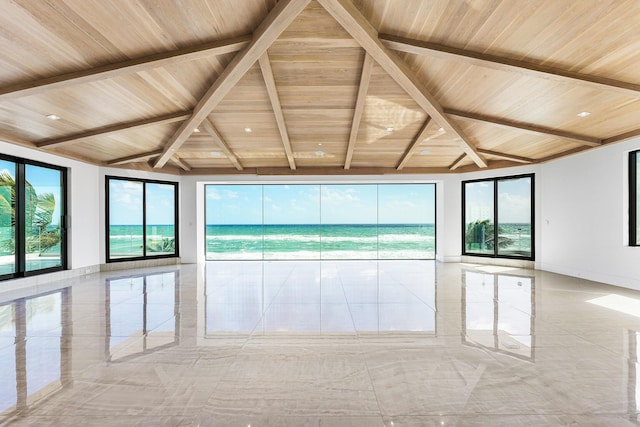 empty room with baseboards, marble finish floor, vaulted ceiling with beams, and wood ceiling