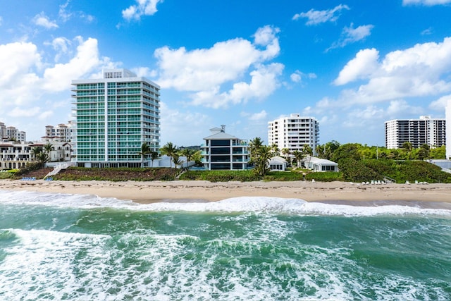 view of water feature featuring a view of the beach and a city view