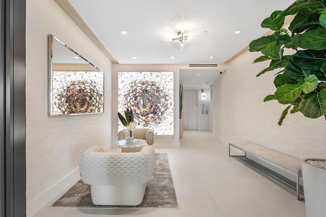 corridor featuring baseboards and recessed lighting