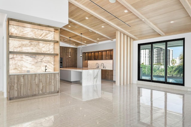 kitchen featuring wooden ceiling, a kitchen island, modern cabinets, marble finish floor, and recessed lighting