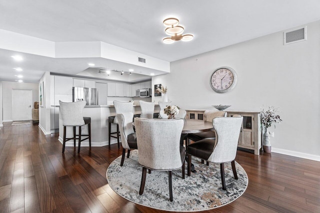 dining area featuring dark hardwood / wood-style flooring