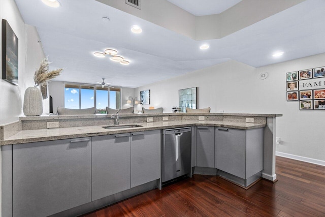 kitchen featuring kitchen peninsula, sink, ceiling fan, stainless steel dishwasher, and dark hardwood / wood-style floors