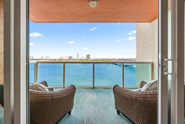 balcony featuring a water view