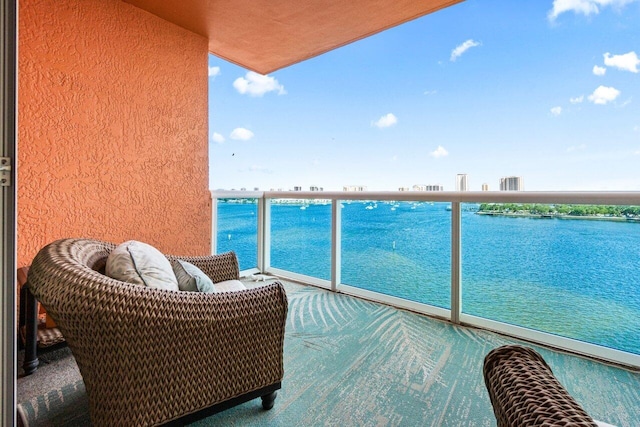 balcony featuring a water view