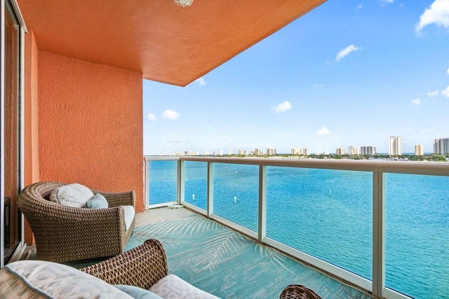 balcony featuring a water view