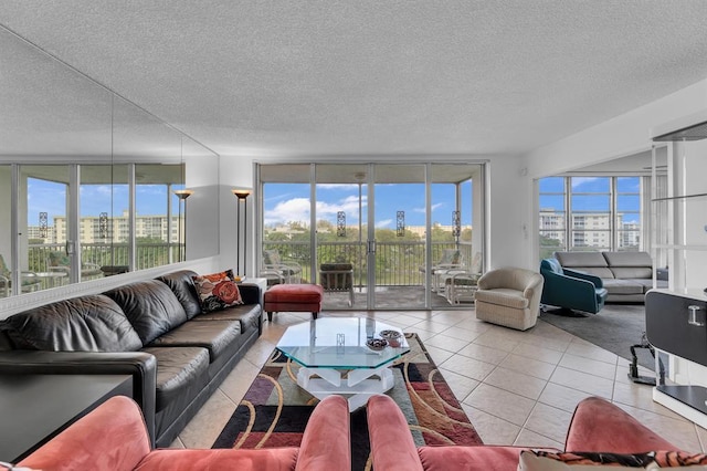 tiled living room featuring floor to ceiling windows, a textured ceiling, and plenty of natural light