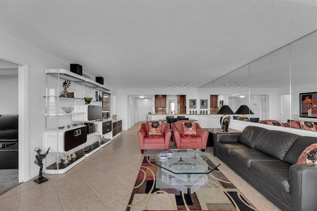 tiled living room with a textured ceiling