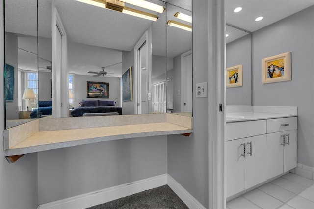 bathroom featuring ceiling fan and tile patterned floors