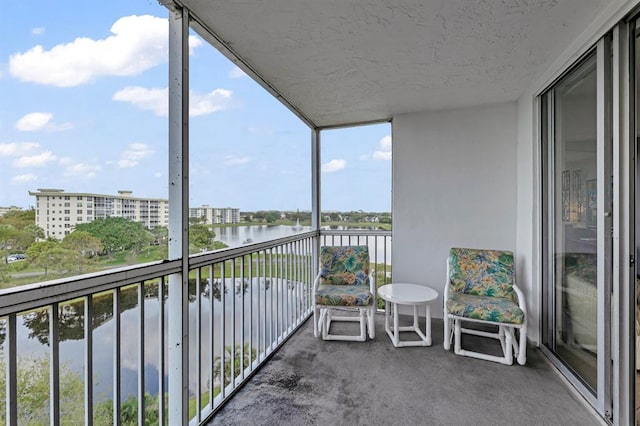 balcony featuring a water view