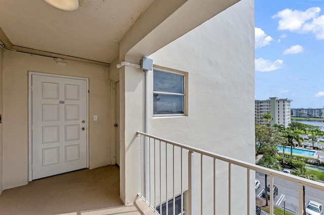 doorway to property featuring a balcony