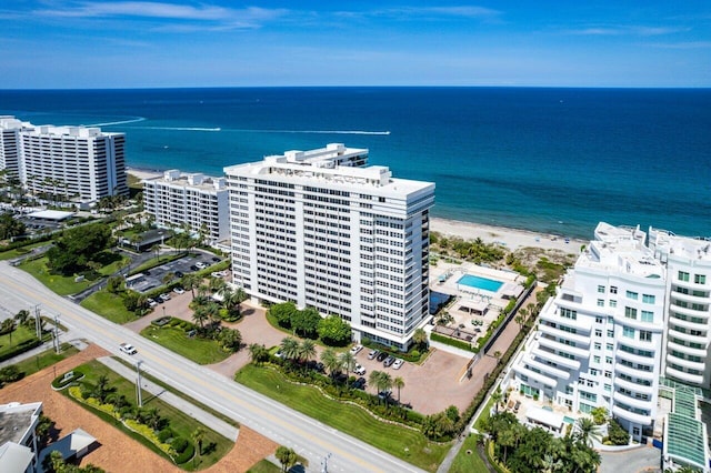 drone / aerial view with a water view and a view of the beach