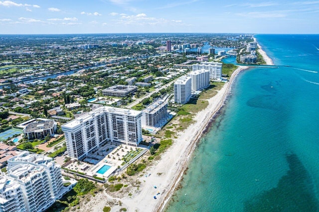 drone / aerial view featuring a water view and a beach view