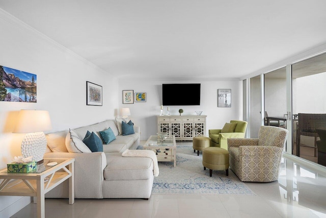 living room featuring expansive windows and light tile patterned floors