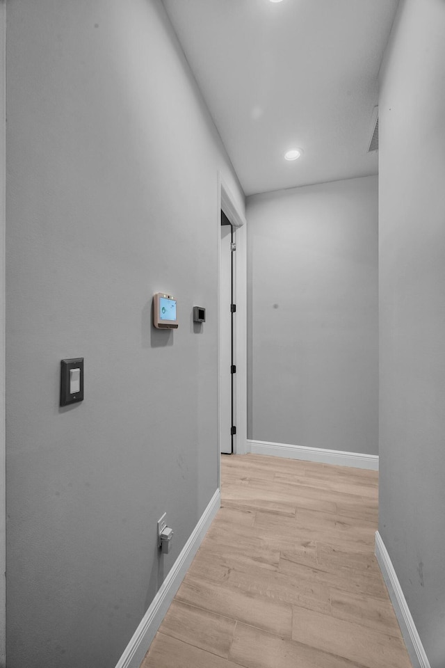 corridor featuring light hardwood / wood-style floors