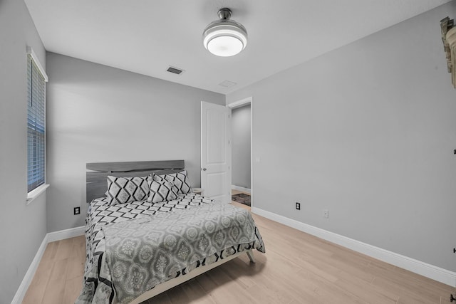 bedroom with light hardwood / wood-style floors