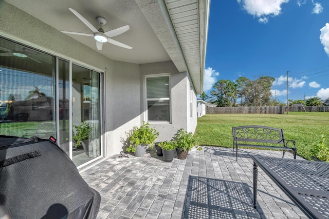 view of patio featuring ceiling fan