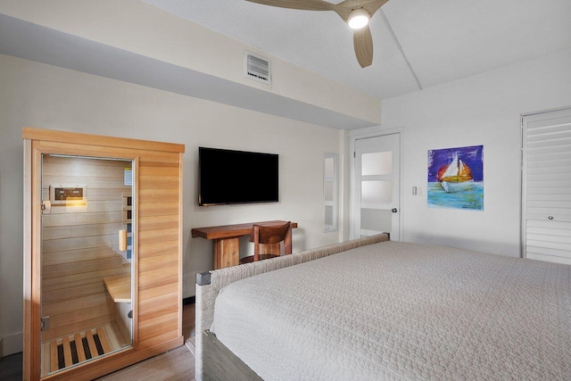 bedroom featuring hardwood / wood-style floors and ceiling fan