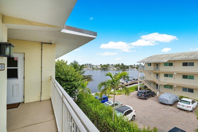 balcony featuring a water view