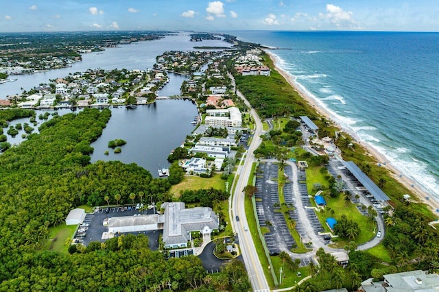 bird's eye view featuring a water view and a view of the beach