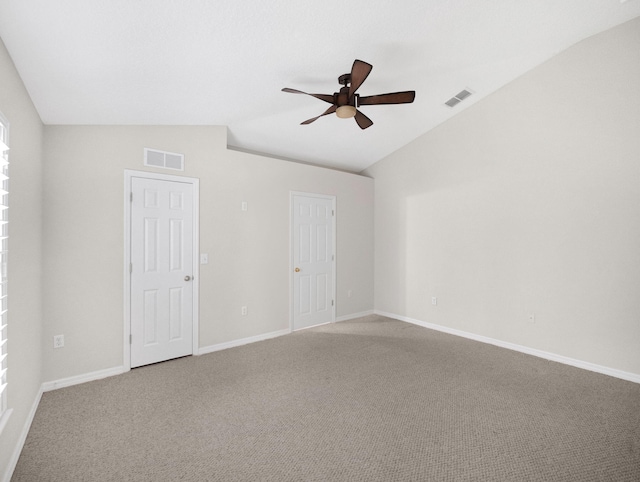 unfurnished room featuring ceiling fan, carpet, and vaulted ceiling