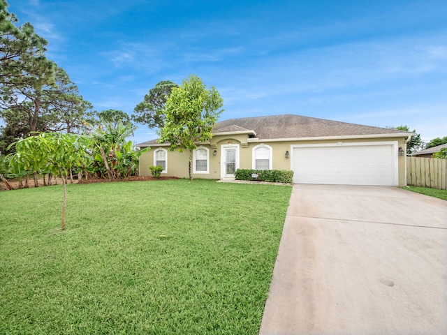 ranch-style home with a garage and a front lawn