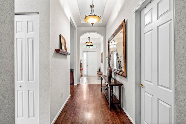 corridor with dark wood-type flooring