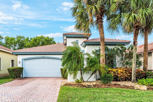 mediterranean / spanish house featuring a garage