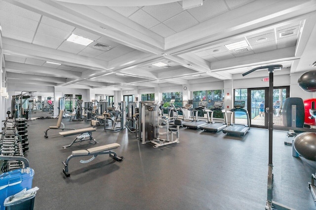 gym with a paneled ceiling