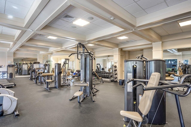 workout area featuring a paneled ceiling and coffered ceiling