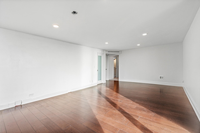 spare room featuring hardwood / wood-style floors